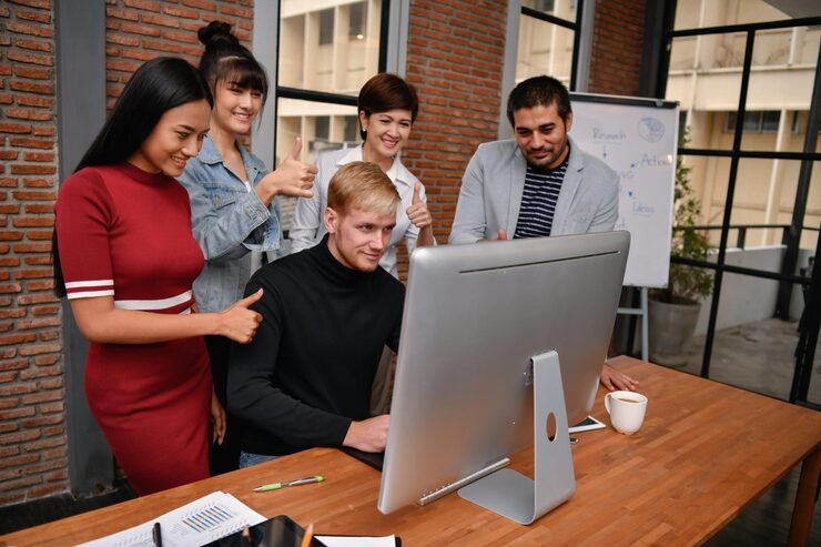 Promoters & Developers business people looking computer gesturing office 1048944 28973969